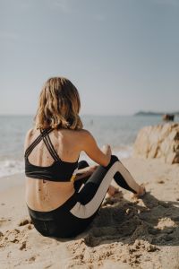 Kaboompics - Woman sitting on beach