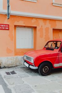 Kaboompics - An old red Renault 4 car parked on the street in Izola, Slovenia