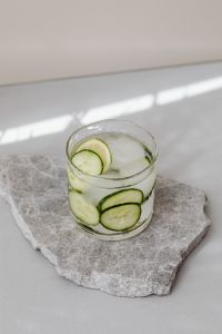 Kaboompics - Water glass - cucumber - ice cubes - marble