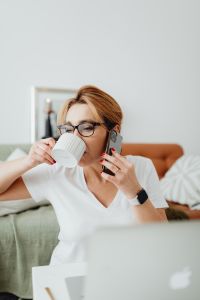 Kaboompics - Woman drinks coffee - talking on the mobile phone