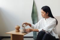 Kaboompics - Asian adult sits in chair and drink coffee - Chemex