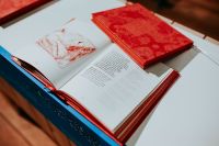 Kaboompics - Red book on a white table