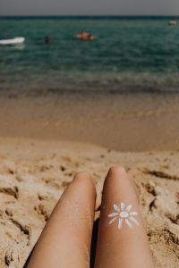 Kaboompics - A beautiful blonde sunbathing on a beach in Sardinia