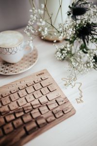 Kaboompics - Wooden keyboard, coffee and flowers