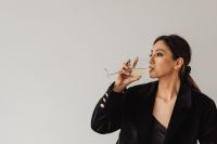 Sophisticated Wine Tasting Portraits - Modern Asian Woman in Elegant Black Outfit Holding White Wine Glass