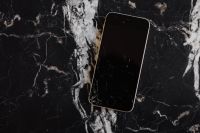 Broken Mobile on Marble Table