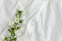Kaboompics - Mockup photo - white bedding - flowers - blank sheet - square