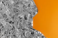 Kaboompics - Silver Foil Texture & Orange Background