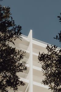 Kaboompics - White minimalist building with metal railings