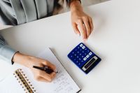 Accountant With Calculator And Notes