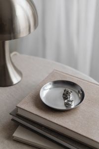 Kaboompics - Metal desk lamp - Silver Jewelry - Linen Tablecloth