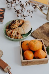 Kaboompics - Orange - croissant - cutting board ona table