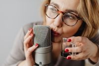 Kaboompics - Woman Recording ASMR Sounds On Microphone