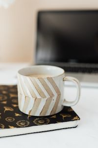 Kaboompics - Laptop - organizer & cup of coffee on marble table