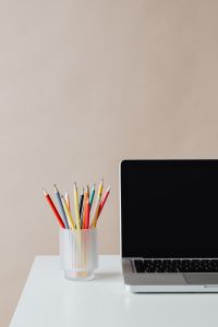 Kaboompics - Laptop and pencils on desk - empty screen - mockup