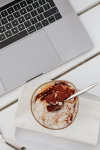 Kaboompics - Working with a laptop by the sea. Cup of coffee and delicious tiramisu, Marina di Puolo, Italy