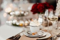 Kaboompics - Coffee with whipped cream in a porcelain cup on a Christmas table