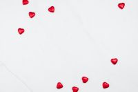 Valentine Background with Red Hearts on a white Marble