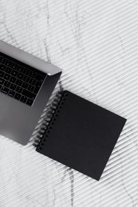 Kaboompics - blackbook & laptop on marble