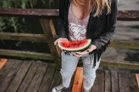 Kaboompics - Blonde woman having a healthy snack at the wooden pier