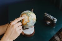 Kaboompics - Male Finger Showing A Part Of The World On An Globe
