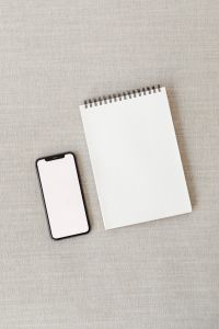 Kaboompics - Mockup photo - cell phone - iPhone 11 Pro - blank screen - notebook