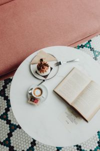 Kaboompics - Opened book, meringue with whipped cream and coffee on white marble