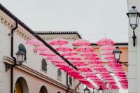 Kaboompics - Hundreds of Floating Pink Umbrellas Above a Street