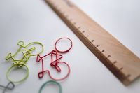 Kaboompics - Bicycle paper clips and a wooden ruler