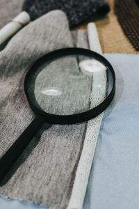 Kaboompics - Magnifying glass with fabric on a table