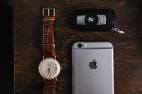 Kaboompics - Apple iPhone 6, Vintage watch on a brown leather wallet, BMW car key