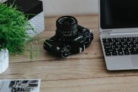 Kaboompics - Black-and-white photos with a silver laptop and a camera