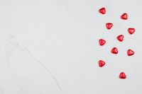 Valentine Background with Red Hearts on a white Marble