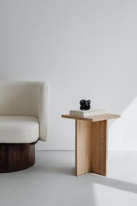 Kaboompics - Modern oak side table - armchair with light boucle fabric - minimalist interior - book