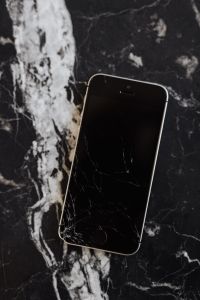 Kaboompics - Broken Mobile on Marble Table