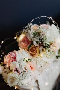 Bouquet of flowers in a bag with some fairy lights