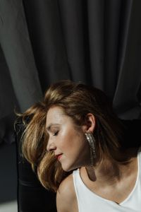 Kaboompics - Woman is wearing beautiful zirconia earrings