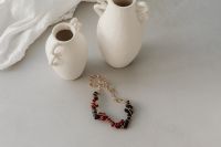 Kaboompics - Elegant Jewelry and Decor: Necklaces, Bracelets, and Vases - Free Stock Photo Collection