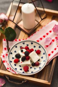 Kaboompics - Summer berries with a sweet dessert on a plate in a drawer