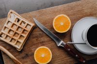 Kaboompics - Cup of coffee, knife, waffle, oranges