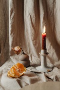 Kaboompics - Candle - linen fabric - mandarine - dried rose