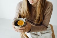 Young girl holds tea