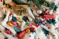 Kaboompics - Christmas gift and colourful tree decorations on a blanket