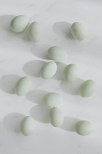 Kaboompics - Easter flat lay with green eggs on a white marble