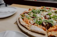 Kaboompics - Eating delicious pizza in a cozy restaurant