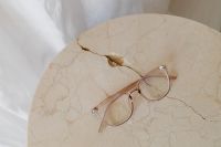 Kaboompics - Corrective glasses lie on a marble table