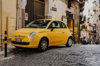 Kaboompics - Yellow modern little car, Fiat 500, parked on a street in Naples