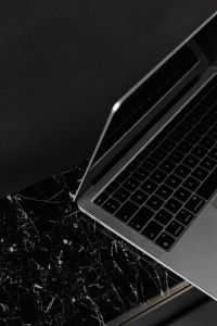 Kaboompics - Macbook Pro laptop - marble - decorative plaster on wall - black aestheticsMacbook Pro laptop - marble - decorative plaster on wall - black aesthetics
