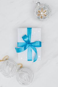 Christmas gift with blue ribbon