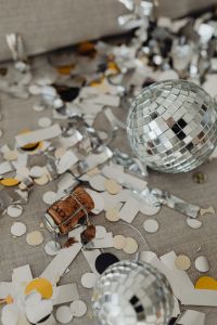 Kaboompics - New Year's Eve party mess - confetti - disco balls